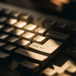 Close-up of a mechanical keyboard on a desk for an article about the UX Maturity Model.